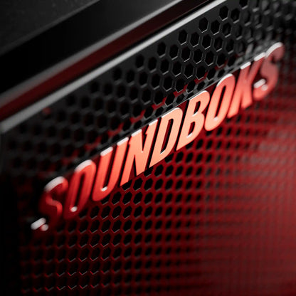 Close-up of 'SOUNDBOKS' logo on a black grille.